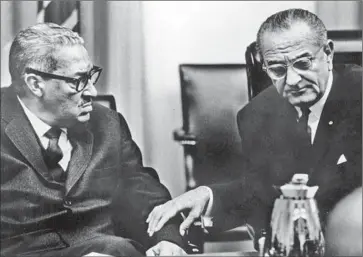  ?? Keystone / Getty Images ?? THURGOOD MARSHALL, left, was nominated to the Supreme Court in 1967 by President Lyndon Johnson.