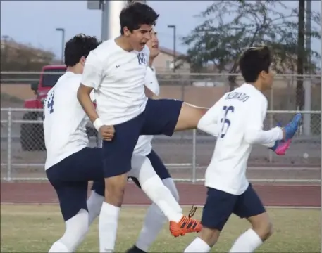  ??  ?? A group of Vincent Memorial High players celebrate an early goal against Army-Navy in the teams’ CIF-SDS Div. V semifinal game on Wednesday at Calexico High’s Ward Field. KARINA LOPEZ PHOTO