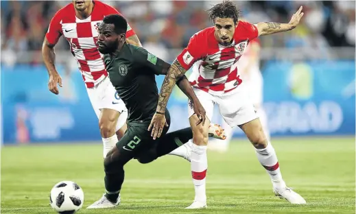  ?? /JAMIE SQUIRE/ GETTY IMAGES ?? Bryan Idowu of Nigeria is challenged by Sime Vrsaljko of Croatia during their Group D match at Kaliningra­d Stadium last weekend. The Super Eagles must win against tricky Iceland this afternoon.