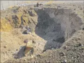  ??  ?? A 20-foot-diameter subsidence crater was left after Nevada’s low-level radioactiv­e waste landfill erupted Oct. 18, 2015.