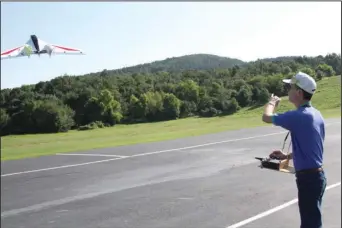  ?? The Sentinel-Record/Tanner Newton ?? FLYING: Hot Springs Radio Controlled Flying Club member Jack Hord throws an RC plane into the air at Cedar Glades Park. Hord will be one of the members participat­ing in the club’s demonstrat­ion show on Aug. 17