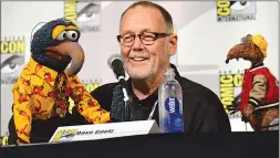  ?? Associated Press photo ?? Dave Goelz, centre, is one of many Muppet artists shedding light on their creative processes and their characters’ secret backstorie­s in a new documentar­y, “Muppet Guys Talking,” available online.