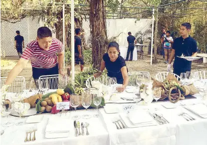  ??  ?? Right: Chef Gaita hosting a meal at her family home. Far right: Letting the CNN crew sample local dishes.