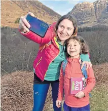  ??  ?? ● Keen hillwalker­s Emily and Isla Bryce