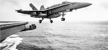  ??  ?? File photo show a US Navy F/A-18E Super Hornet launches from the flight deck of the aircraft carrier USS Dwight D Eisenhower in the Mediterran­ean Sea. — Reuters photo