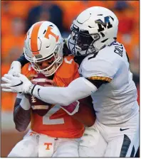  ?? AP/WADE PAYNE ?? Tennessee quarterbac­k Jarrett Guarantano (2) is sacked by Missouri safety Tyree Gillespie (9) in the Volunteers’ 50-17 loss to Missouri on Saturday in Knoxville, Tenn. Guarantano left the game with an injury and was replaced by Keller Chryst.