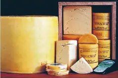  ?? Photos: FAIRFAX NZ ?? Resurgence: Above, Barry’s Bay Cheese factory owners Catherine and Mike Carey. Left, Barrys Bay’s 36kg cheddar truckle, and right, cheese stored in the cool room at Barry’s Bay Cheese factory.