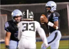  ?? DEBBY HIGH/FOR DIGITAL FIRST MEDIA ?? North Penn’s QB Solomon Robinson looks for an open receiver on Friday night against Ridley.