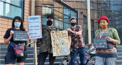  ?? Irwin Mitchell ?? > The four supporters of the Colston 4, who were wrongly arrested and fined for gathering outside Bristol Magistrate­s’ Court on January 25. Below, the toppling of the Colston statue on June 7 last year