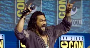  ??  ?? Jason momoa greets the crowd at the Warner Bros. Theatrical panel for “aquaman” on day three of Comic-Con internatio­nal on Saturday. PhOTO by chrIS PIzzELLO/INVISION/AP