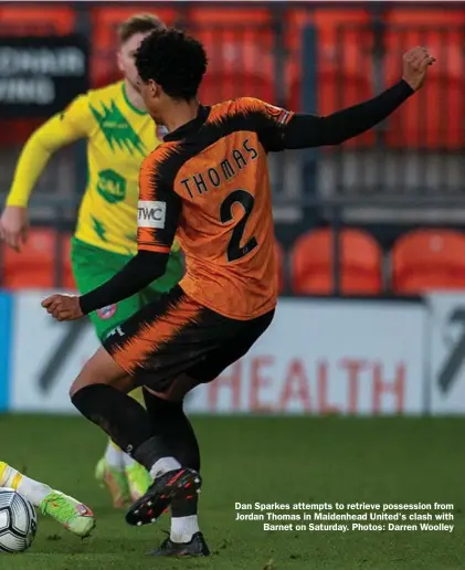  ?? ?? Dan Sparkes attempts to retrieve possession from Jordan Thomas in Maidenhead United's clash with
Barnet on Saturday. Photos: Darren Woolley