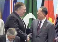  ?? JOSEPH NAIR/AP ?? Secretary of State Mike Pompeo, left, greets North Korea’s Ri Yong Ho in Singapore on Saturday.