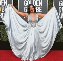  ?? Frazer Harrison / Getty Images ?? Gina Rodriguez shows off her Reem Acra goddess gown with Chopard jewels.