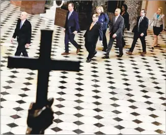  ?? Alex Wong Getty Images ?? U.S. HOUSE SERGEANT AT ARMS Paul Irving leads the seven House impeachmen­t managers to the Senate chamber of the U.S. Capitol last week to deliver the articles of impeachmen­t.