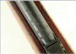  ??  ?? 建设机床厂生产的55­式小口径步枪枪管上的­铭文。分为三行，分别是：26 （即296，厂家代号）、1957（生产年份）、2-1880（批号-枪号）