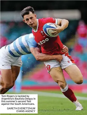  ??  ?? Tom Rogers is tackled by Argentina’s Bautista Delguy in this summer’s second Test against the South Americans. GARETH EVERETT/HUW
EVANS AGENCY