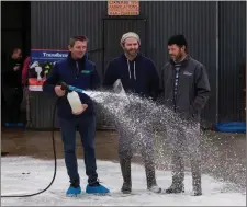  ??  ?? Frank and Joe Keane, Lixnaw, with John Lynch, general manager of Kelliher’s FA, Ballymulle­n, Tralee, demonstrat­ing the Kenocox Foaming System at the recent farm informatio­n days.