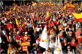  ??  ?? Nationalis­t activists march during a mass rally against Catalonia’s declaratio­n of independen­ce, in Barcelona, Spain on Sunday. —