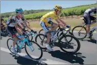  ?? PICTURE: AP ?? PIONEER: Daryl Impey, wearing the overall leader’s yellow jersey, and Andy Schleck of Luxembourg, left, ride in the pack during the seventh stage of the Tour de France.