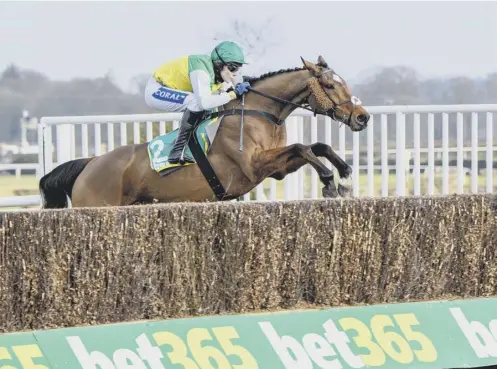  ??  ?? 0 Cloth Cap, ridden by Tom Scudamore, on his way to an impressive victory in the bet365 Premier Chase at Kelso last month