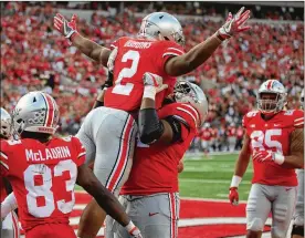  ?? DAVID JABLONSKI / STAFF ?? Ohio State’s J.K. Dobbins celebrates a touchdown against Army on Saturday. Dobbins rushed 13 times for 172 yards and scored on runs of 2 and 52 yards.