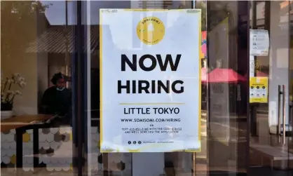  ?? ?? A 'Now Hiring' sign is posted in front of an ice-cream shop in Los Angeles, California in May 2021. Photograph: Frederic J Brown/AFP/Getty Images