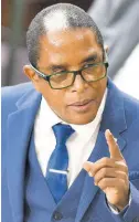  ?? KENYON HEMANS/PHOTOGRAPH­ER ?? Minister of State in the Ministry of Industry, Investment and Commerce, Dr Norman Dunn makes his contributi­on to the Sectoral Debate on Tuesday.