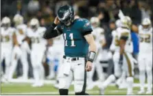  ?? BUTCH DILL — THE ASSOCIATED PRESS ?? Philadelph­ia Eagles quarterbac­k Carson Wentz (11) walks of the field after turning the ball over on downs in the second half of an NFL football game against the New Orleans Saints in New Orleans Sunday.