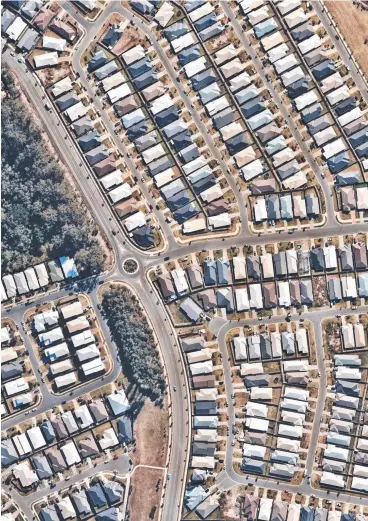  ?? Picture: NEARMAP Picture: MARK CALLEJA ?? Main image: A section of Pimpama from the air last year. Right: Property Council executive director Chris Mountford.
