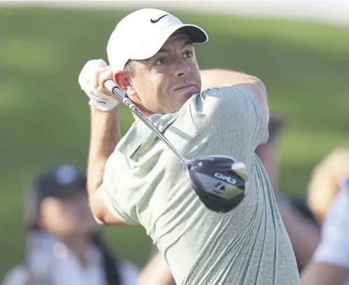  ?? ?? Rory Mcilroy tees off on the 11th hole at Dubai Creek Golf and Yacht Club during the first round of the Dubai Invitation­al yesterday