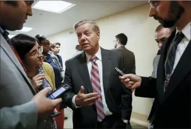  ?? J. SCOTT APPLEWHITE — THE ASSOCIATED PRESS ?? Senate Judiciary Committee Chairman Lindsey Graham, R-S.C., talks to reporters Wednesday on his way to the Senate chamber at the Capitol in Washington.