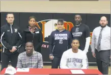  ?? STAFF PHOTO BY AJ MASON ?? North Point High School seniors Malachi McMillan and Keisean Wilson signed their national letters of intent on Wednesday morning, part of National Signing Day. McMillan will be heading to NCAA Division II Fairmont State University (W.Va.) and Wilson is...