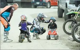  ?? PHOTOS BY DAN HONDA – STAFF PHOTOGRAPH­ER ?? The Jacobs family, of Santa Cruz, including Joey Jacobs, 1, far right, and his mom Megan Jacobs, enjoy a day at the 408MX motocross track at the Santa Clara County Fairground­s in San Jose on Saturday.