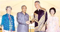  ??  ?? Dr Mahathir with Lee and their wives Dr Siti Hasmah and Ho Ching during the courtesy call at the Perdana Leadership Foundation yesterday.