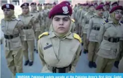  ?? —AFP ?? MARDAN: Pakistani cadets parade at the Pakistan Army’s first Girls’ Cadet College in Mardan.