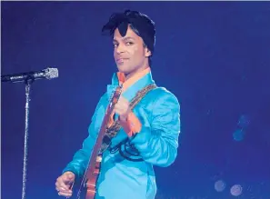  ?? AP Photo/David J. Phillip, File ?? ■ In this Feb. 4, 2007, file photo, Prince performs during the halftime show at the Super Bowl XLI football game at Dolphin Stadium in Miami.