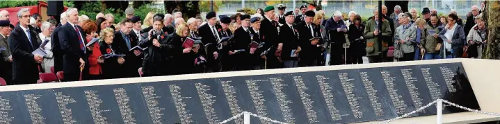  ??  ?? Official unveiling of the Pontypridd War Memorial roll of honour which names all the soldiers from Taff Ely who have died in conflicts since World War I at Ynysanghar­ad Park in 2011