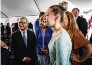  ?? JIM NOELKER / STAFF ?? Gov. Mike DeWine (left) along with his wife, Fran DeWine, meet with Emma Brun from Miamisburg after he announced the Dayton Children’s Hospital will break ground on a $100 million building devoted to mental and behavioral health for children.