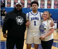  ?? JASON SCHMITT — FOR MEDIANEWS GROUP ?? Madison Heights Lamphere senior Sema-j Ramsey scored his 1,000th career point during Thursday night’s game against Sterling Heights. Here he poses with his uncle, Allen Ramsey, and his mother, Anita Holmes, moments after scoring his historic point.