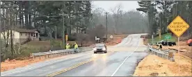  ?? / Adam Cook ?? The bridge over Peavine Creek along Three Notch Road in Catoosa County reopened Dec. 20 after being closed to traffic for 14 months.