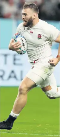  ??  ?? Luke Cowandicki­e runs in to score England’s bonus-point try against Tonga