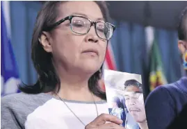  ??  ?? Debbie Baptiste, mother of Colten Boushie, holds a photo of her son during a news conference on Parliament Hill in Ottawa on Feb. 14.