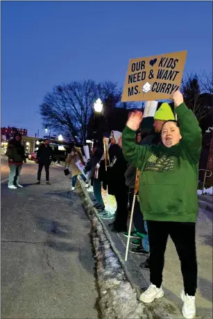  ?? COURTESY TRACY BARNJUM ?? Members of the grassroots group Stand for Curry attended the Feb. 5 Fitchburg School Committee meeting and held signs in support of Alexis Curry, the Goodrich Academy principal who has been on