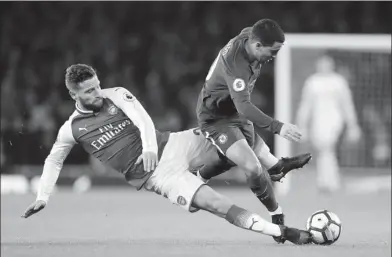  ?? FRANK AUGSTEIN / AP ?? Chelsea’s Eden Hazard (right) vies for the ball with Arsenal’s Shkodran Mustafi during their 2-2 English Premier League draw at Emirates stadium in London on Wednesday.