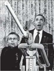  ?? SAUL LOEB/GETTY-AFP 2012 ?? President Barack Obama marvels as Joey Hudy fires a marshmallo­w from his “Extreme Marshmallo­w Cannon.”