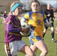  ??  ?? Wexford’s Kellie Kearney is chased by Clare’s Grainne Nolan.