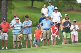  ?? THE ASSOCIATED PRESS ?? Spectators watch the action on the first green Monday at the Wells Fargo Championsh­ip golf tournament Pro-Am in Wilmington, N.C. The Wells Fargo Championsh­ip begins on Thursday.