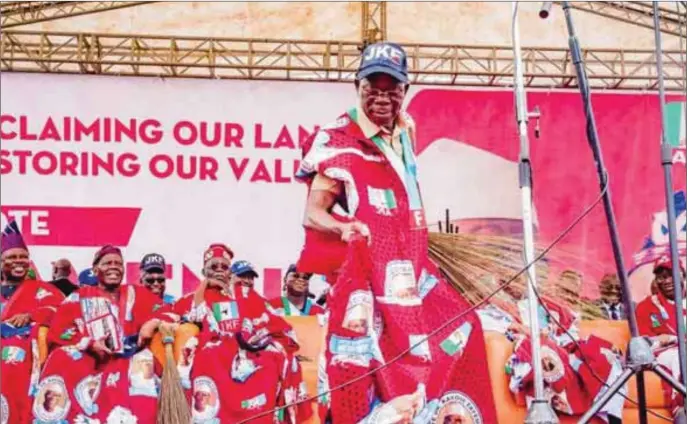  ??  ?? Oshiomhole dances at a party rally as other leaders watch