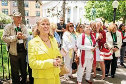  ?? PHOTOS BY SEAN RUSSELL — THE SAGE COLLEGES ?? Susan Scrimshaw, foreground, retiring president of The Sage Colleges, stands among Russell Sage College alumni Saturday morning during a ceremony to re-christen the Scrimshaw Health Sciences Hall on the downtown Troy campus.