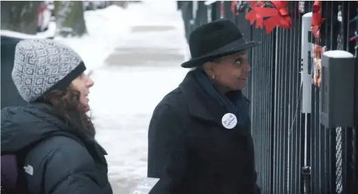  ??  ?? Lori Lightfoot canvasses during her campaign for mayor in “City So Real.”